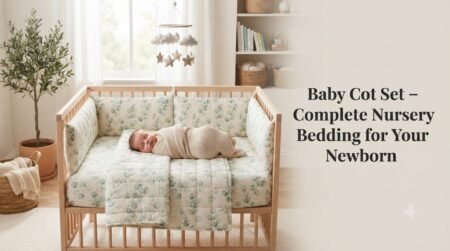 Baby cot set with complete nursery bedding and a sleeping newborn in a modern wooden crib